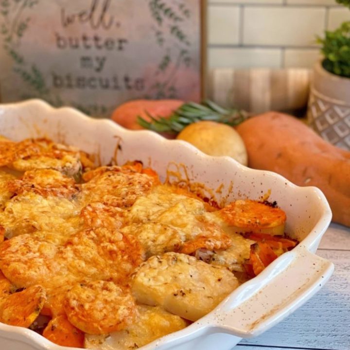 Rosemary Triple-potato gratin in a white baking dish with ingredients behind.
