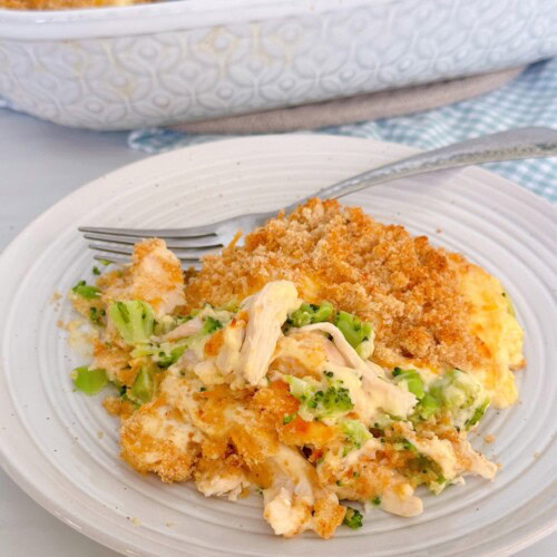 Chicken Broccoli Casserole serving for dinner on a plate with a fork.