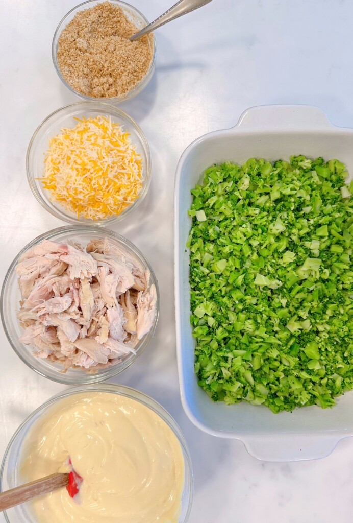 Broccoli placed in the bottom of the casserole dish.