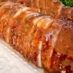 Brushed glaze on the pork tenderloin and sliced ready to eat.