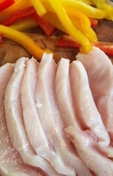 Thinly cut strips of fresh chicken breast and thinly sliced strips of fresh peppers. 