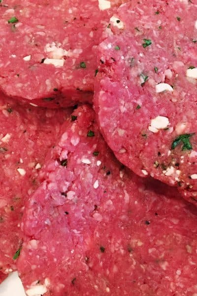 Hamburger Patty's with chunks of feta cheese, fresh parsley, and seasonings ready to hit the grill.