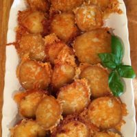 Crispy Garlic Parmesan Potatoes on a platter