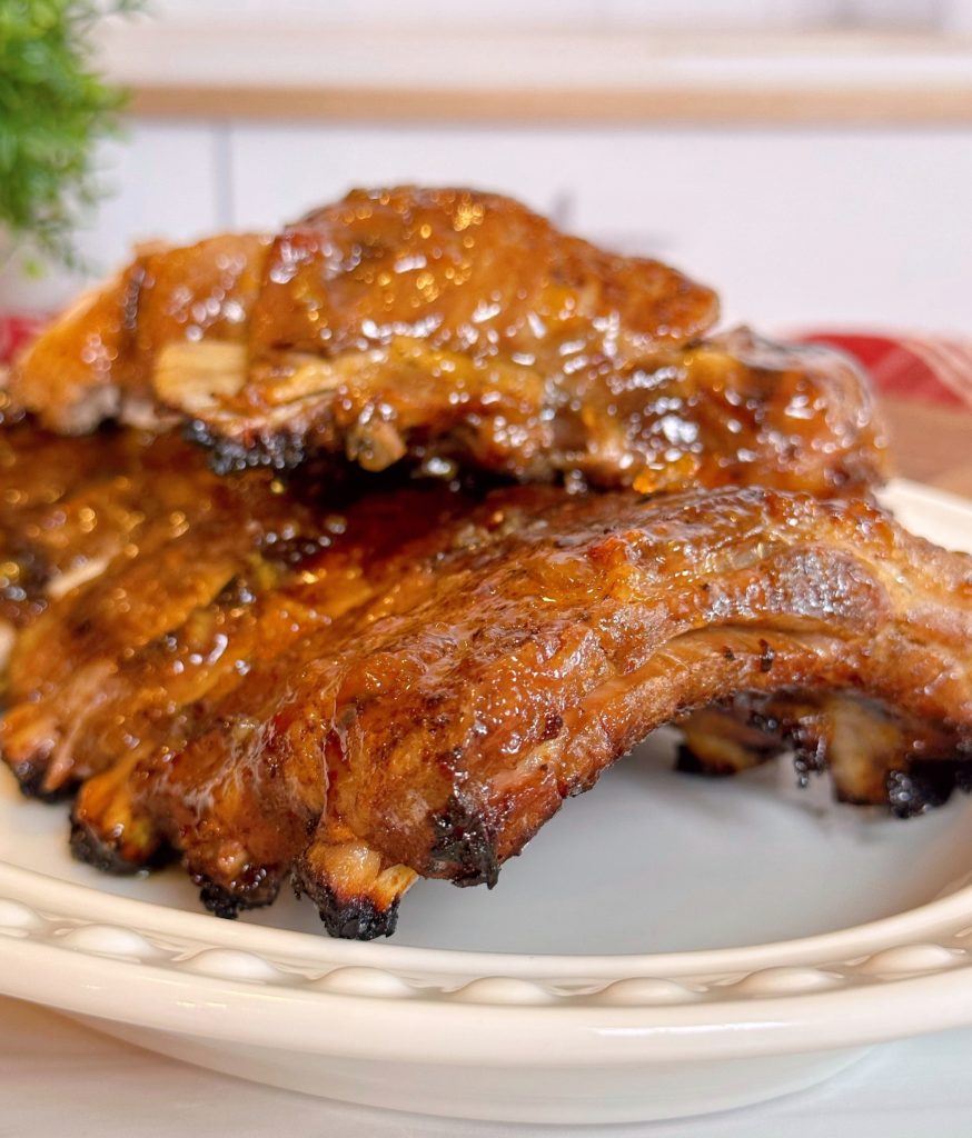 Baby Back Pork Ribs on a platter and stacked high for serving.