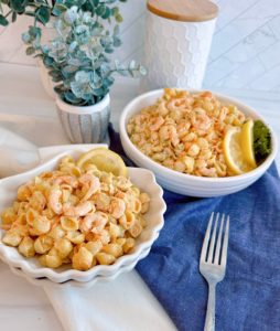Shrimp Pasta Salad in clamshell serving bowls.