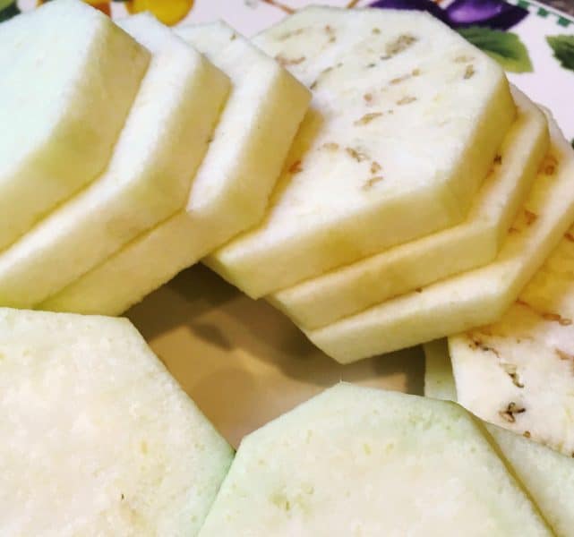 Eggplant sliced ready to dip in egg wash for eggplant parmigiana