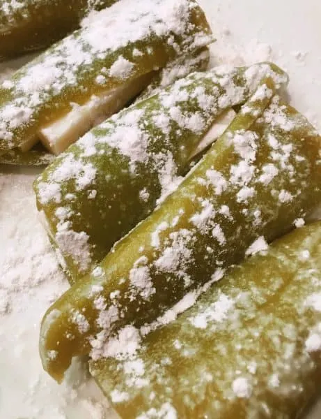 Stuffed chili peppers coated in flour to help egg batter stick to peppers. Chili Relleno preparations.