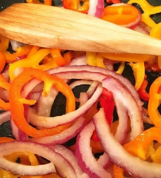 Onions and Peppers in large skillet sauteed over high heat