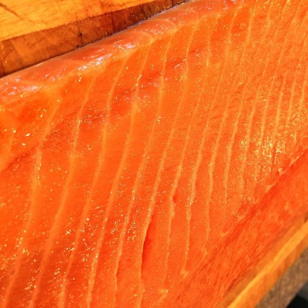 Huge Salmon Fillet on cutting board for Grilled Salmon.