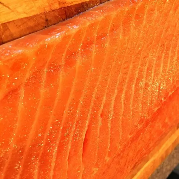 Huge Salmon Fillet on cutting board for Grilled Salmon.