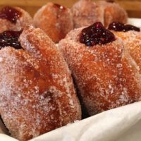 Donuts with a berry filling on a plate