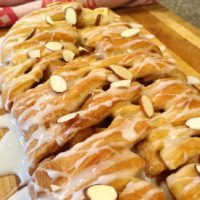 A danish with glaze and slivered almonds