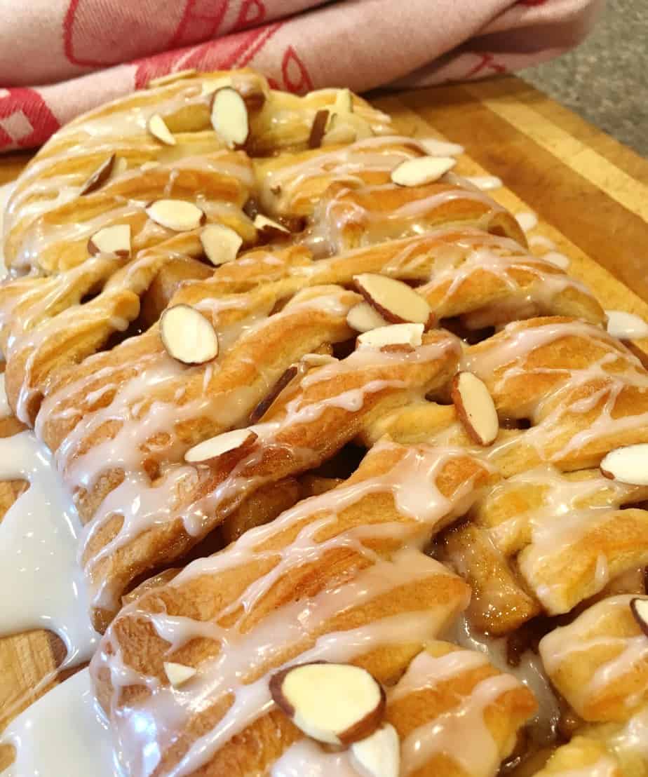 A danish with glaze and slivered almonds