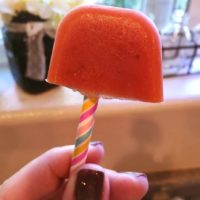 A popsicle made with fruit on a stick
