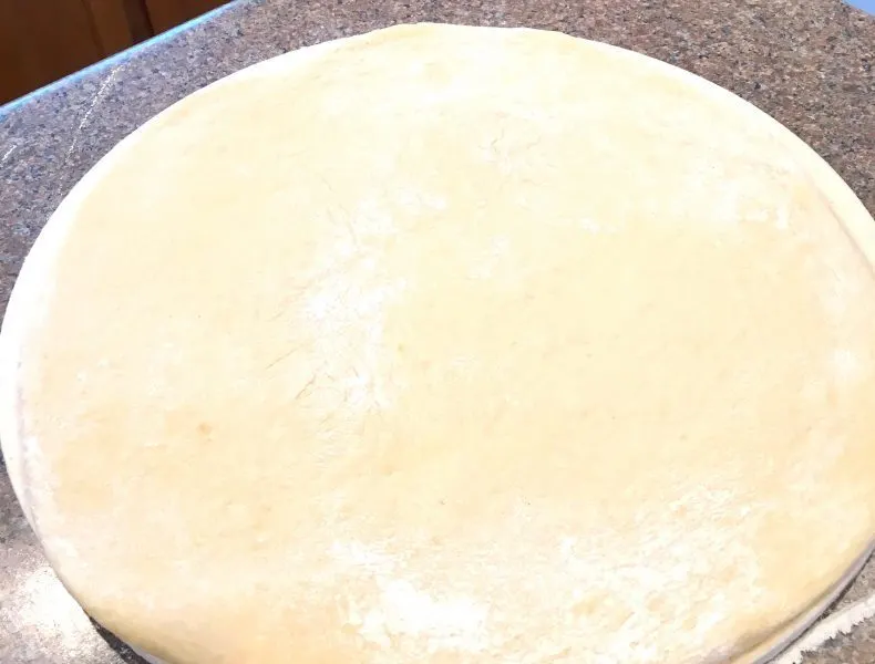 Dinner Rolls rolled out on dough disc