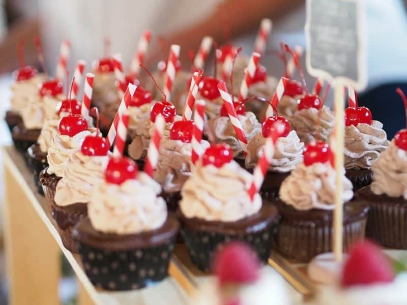 Chocolate cupcakes with a delicious frosting and a cherry on top