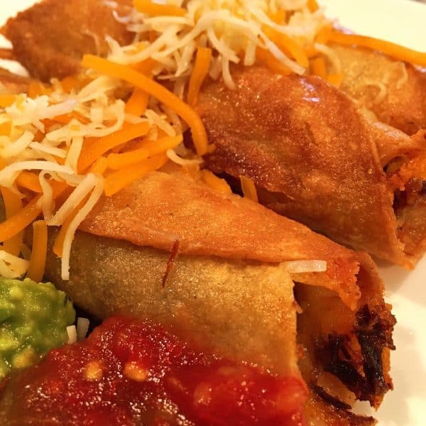 Taquitos with cheese and guacamole