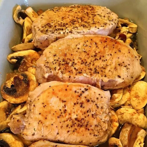 Pork Chops added to the wild rice and mushrooms