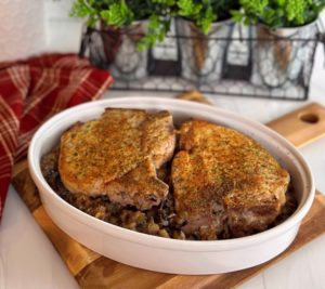 Pork Chops in a casserole dish with rice.