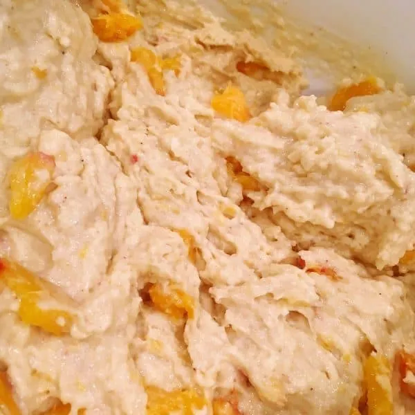 Peaches and Cream scone dough mixed together with fresh peaches