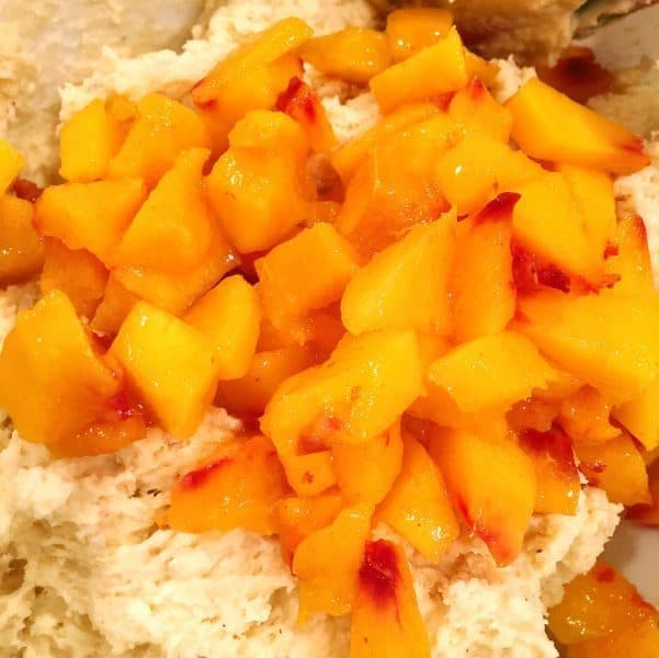 Adding fresh chopped peaches to scone dough