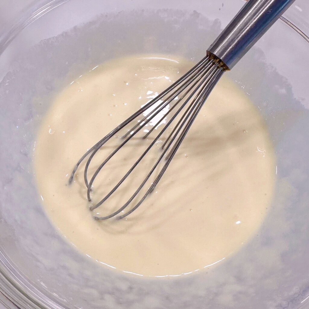 Wet ingredients combined in a small bowl.