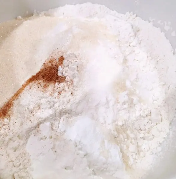 Flour, spices, sugars and dry ingredients in mixing bowl