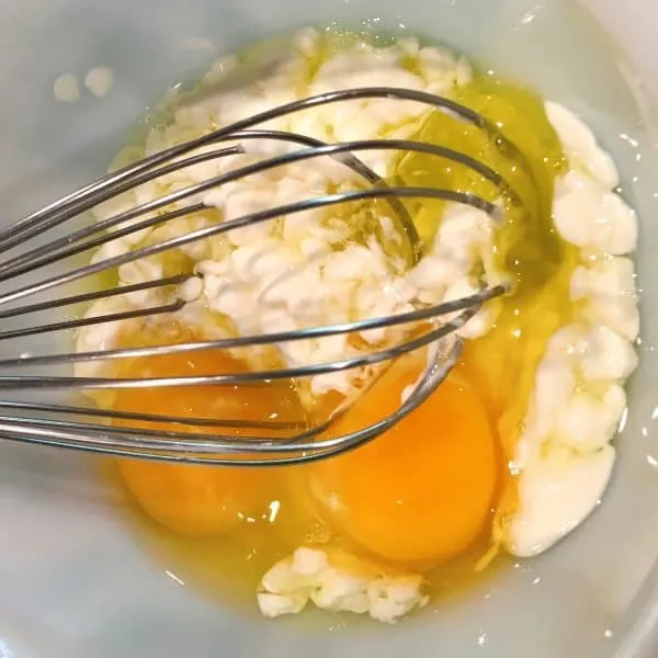 eggs, sour cream, and remaining wet ingredients whisked together