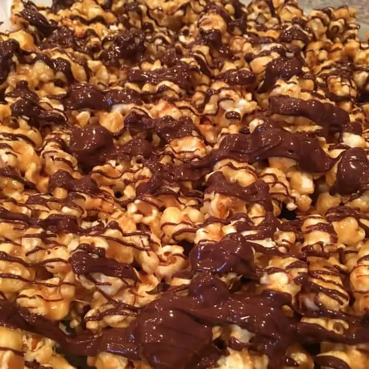 Peanut Butter Chocolate Popcorn on a baking sheet cooling