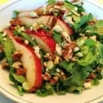 Blue Cheese Pear Salad on a beautiful china dinner plate.