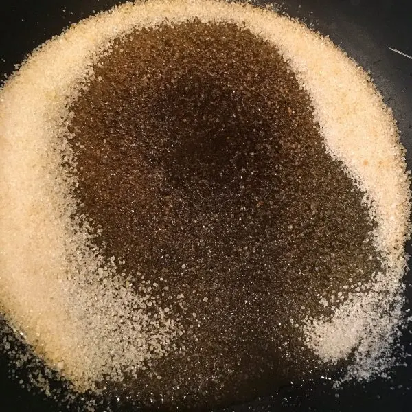 Sugar melting in skillet on stove top