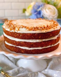 Carrot cake on cake stand.