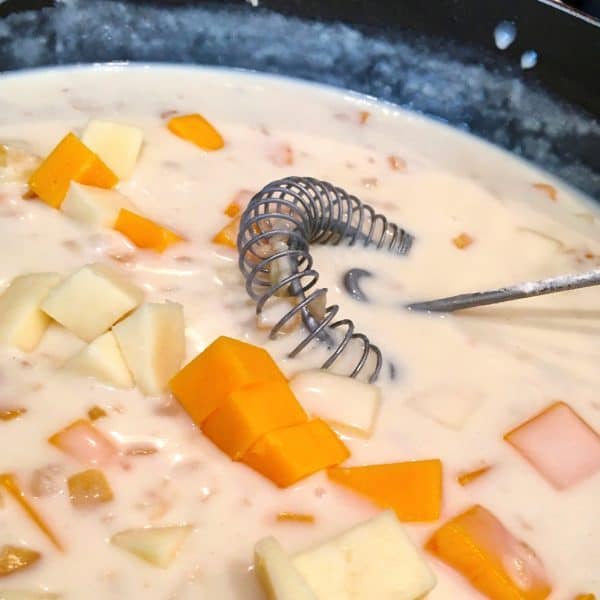 mac n cheese making the rue sauce and adding cheese