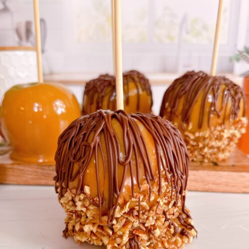 Double caramel apples on a counter top.