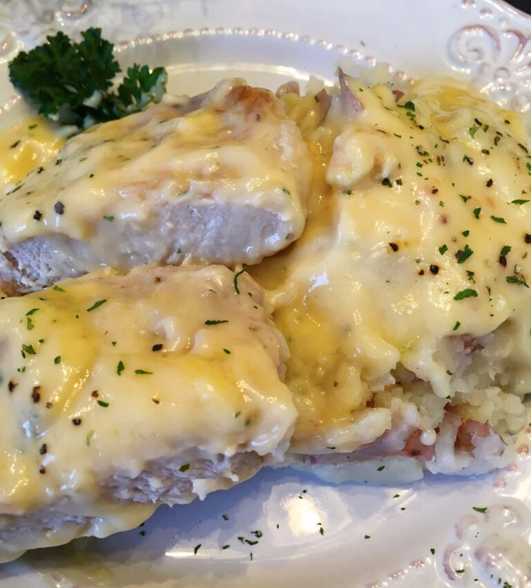 Chicken Fried Pork Cho9ps on a bed of homemade mashed potatoes.