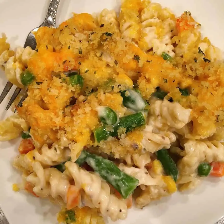 Chicken Noodle Casserole serving on a plate with a fork.