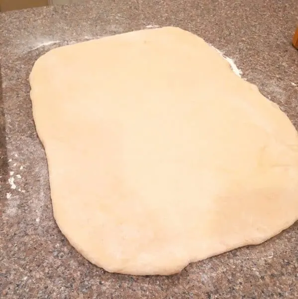 Lion House Cinnamon Roll Dough rolled out into a rectangle
