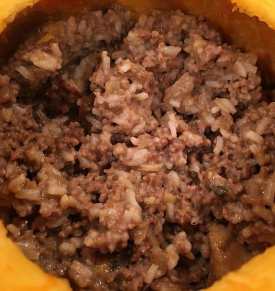 Cooked stuffing in the hallowed out pumpkin