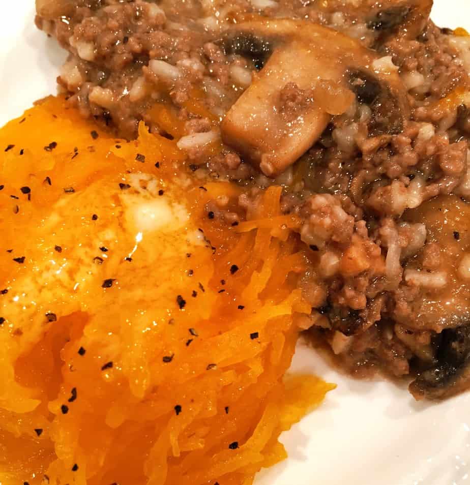A pumpkin filled with ground beef, seasonings and rice