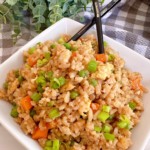 Fried Rice in a white square serving dish with chop sticks.