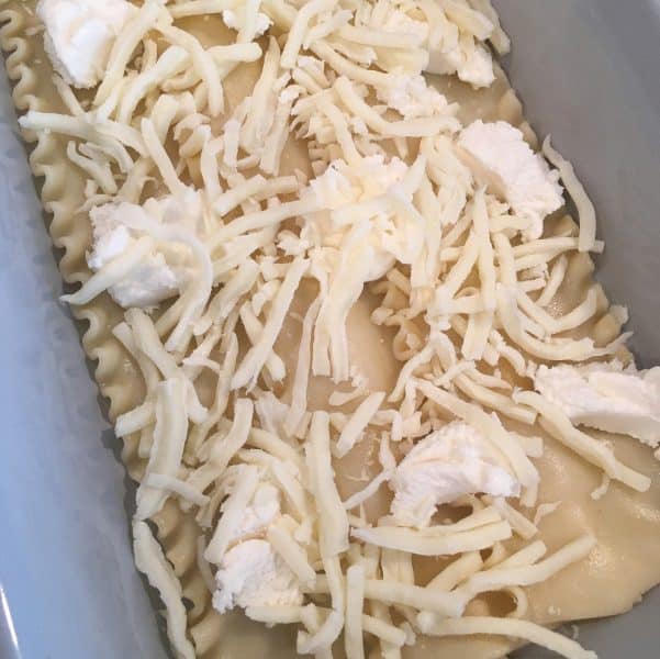 Adding grated cheese to layers