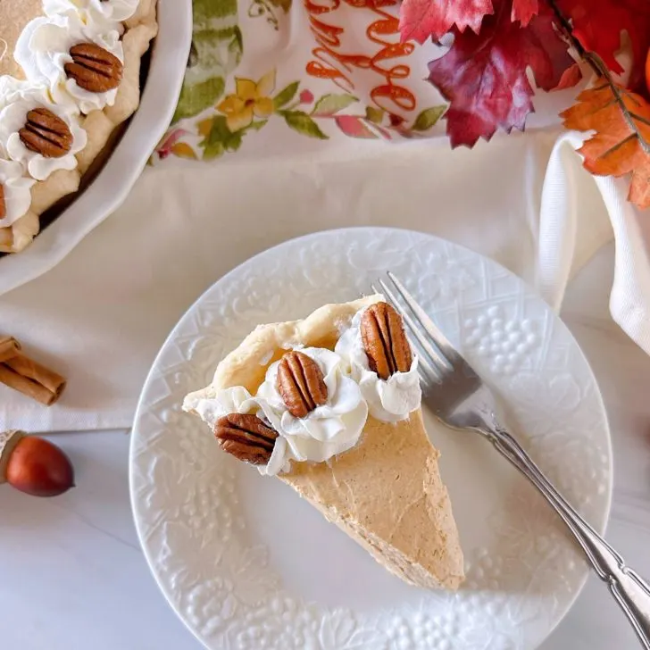 Pumpkin Chiffon Pie sliced on a dessert plate.