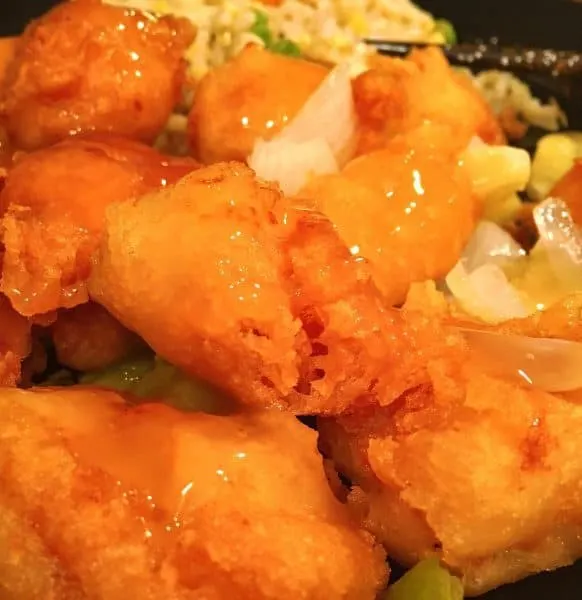 Plate full of tender crispy sweet and sour chicken