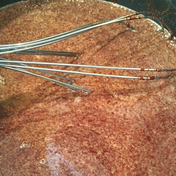 chocolate melting into milk mixture in sauce pan