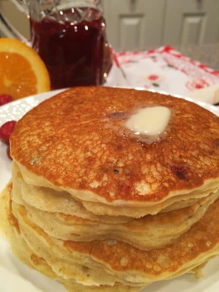 Stack of Cranberry Orange Pancakes with butter