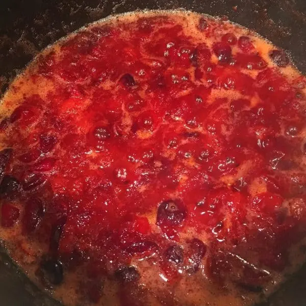 Cranberry Orange Rum syrup thickened and in the sauce pan