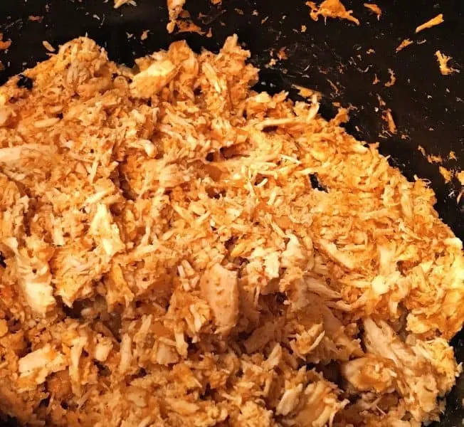 Shredded taco meat in crock pot.