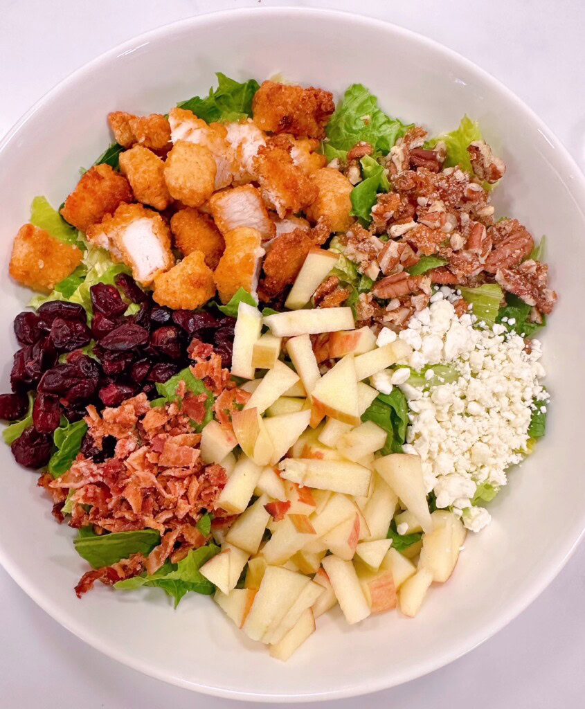 Salad with ingredients on top of the salad.