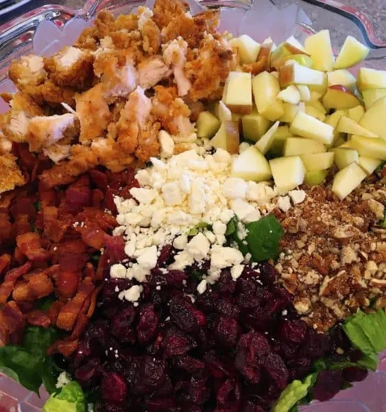 Chopped Autumn Harvest Salad with chicken, apples, candied pecans, feta cheese, bacon, and cranberries