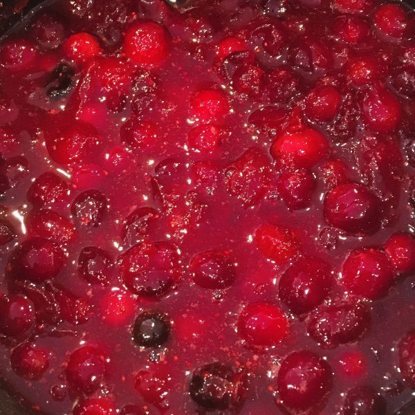 Cranberries popped thickened in the sauce pan.